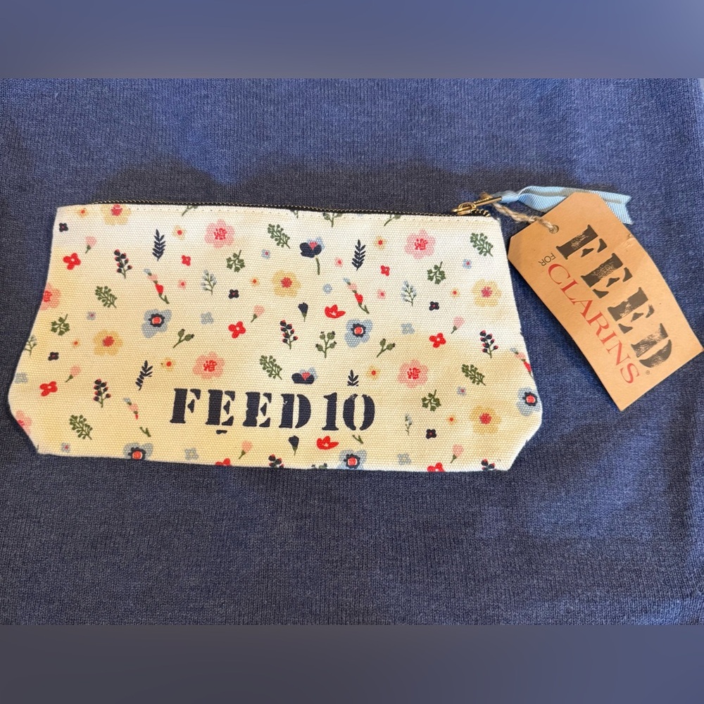 NWT Clarins and FEED 10 collab Floral Canvas Pouch